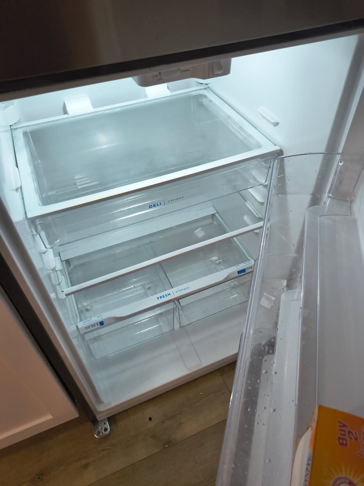 refrigerator shelves and drawers deep cleaned and spotless