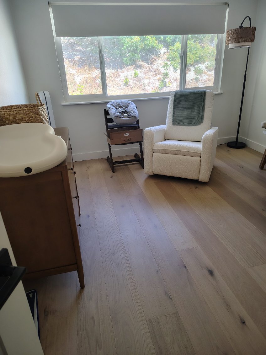 clean nursery with wood flooring and cozy decor after deep cleaning